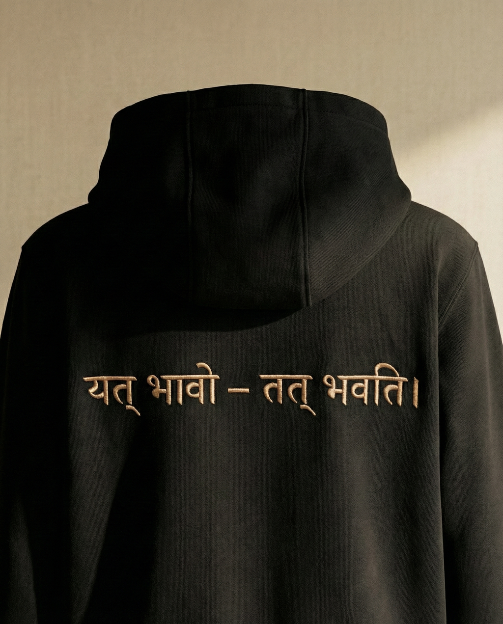 WOVYN Becoming Collection Hoodie - Obsidian Black, back view on a ghost mannequin with Sanskrit embroidery “यत् भावो – तत् भवति”