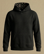 WOVYN Contentment Collection Hoodie - Obsidian Black, front view with kangaroo pocket, tonal logo embroidery, and monogram hood lining