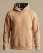 WOVYN Becoming Collection Hoodie - Soft Sand, front view with kangaroo pocket, tonal logo embroidery, and monogram hood lining